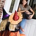 trick-or-treaters getting Halloween candy