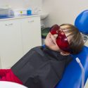 child preparing for sedation dentistry in the dentist's chair
