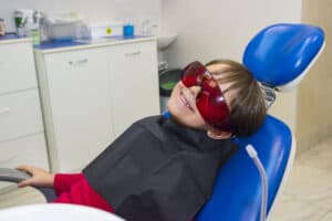 child preparing for sedation dentistry in the dentist's chair