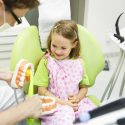 Pediatric Dentist Treating a Child